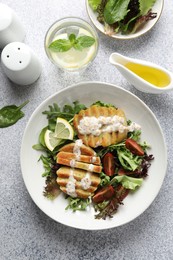 Photo of Healthy dish high in vegetable fats on light textured table, top view