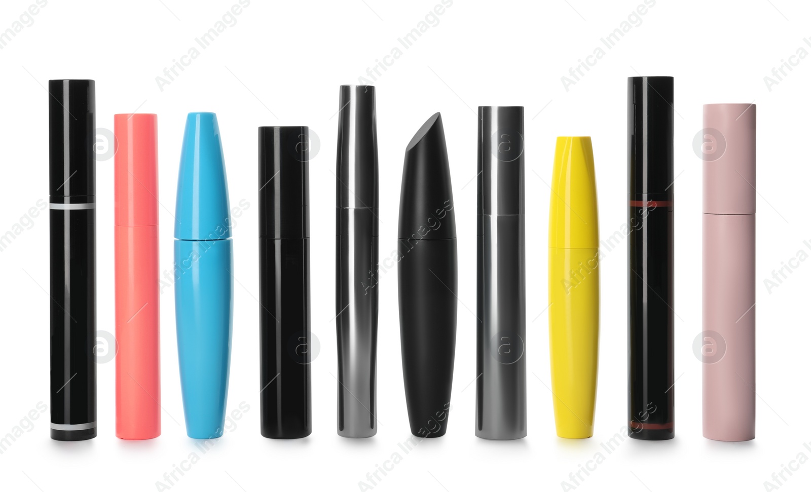 Photo of Many mascaras for eyelashes on white background. Makeup product