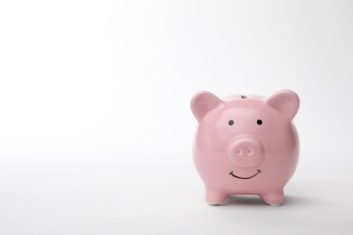 Photo of Pink piggy bank on white background. Money saving