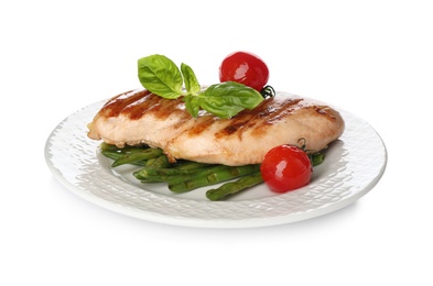 Photo of Tasty grilled chicken fillet with green basil, beans and tomatoes isolated on white