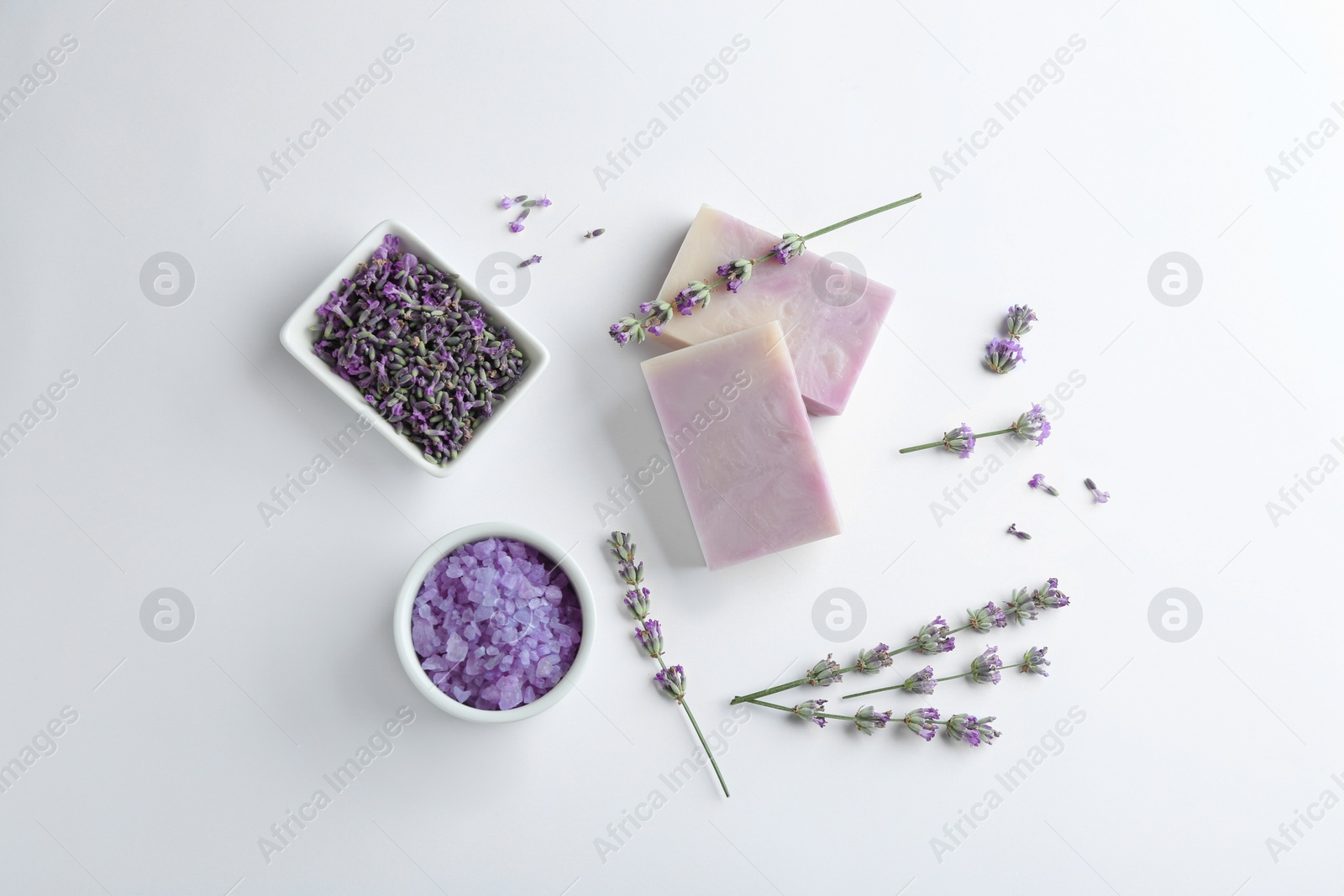 Photo of Composition with hand made soap bars and lavender flowers on white background, top view