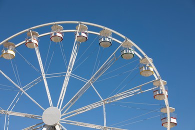 Beautiful white ferris wheel against blue sky