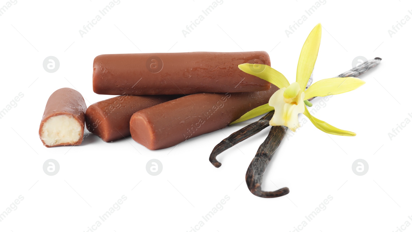 Photo of Glazed curd cheese bars, vanilla pods and flower isolated on white