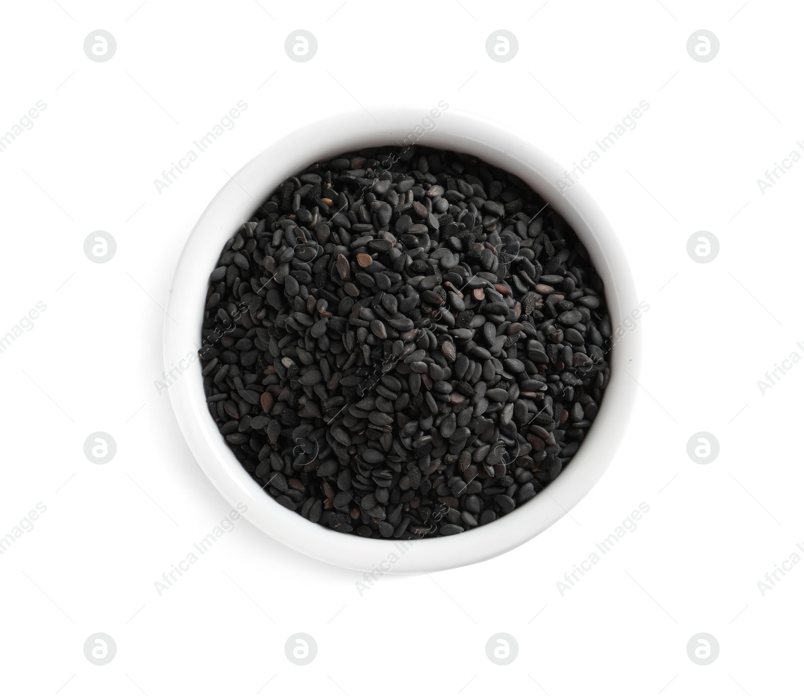 Photo of Black sesame seeds in bowl on white background, top view. Delicious sauce condiment