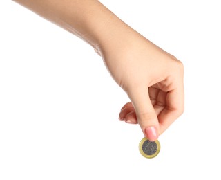 Photo of Woman holding one coin against white background, closeup