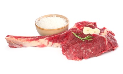 Raw ribeye steak and spices isolated on white