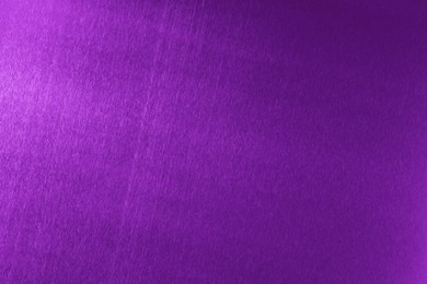 Beautiful purple foil as background, top view