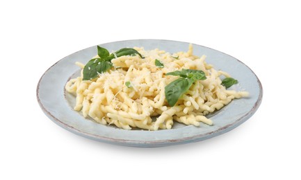 Photo of Plate of delicious trofie pasta with cheese and basil leaves isolated on white