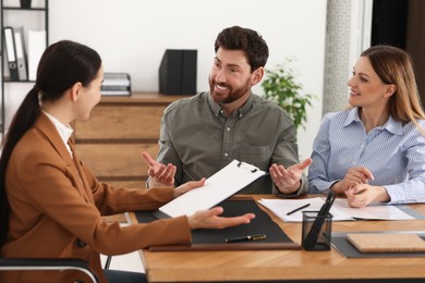 Couple having meeting with lawyer in office