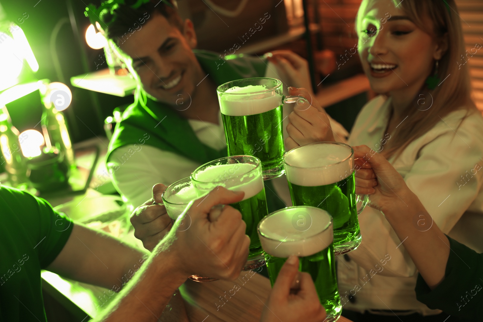 Photo of People with beer celebrating St Patrick's day in pub