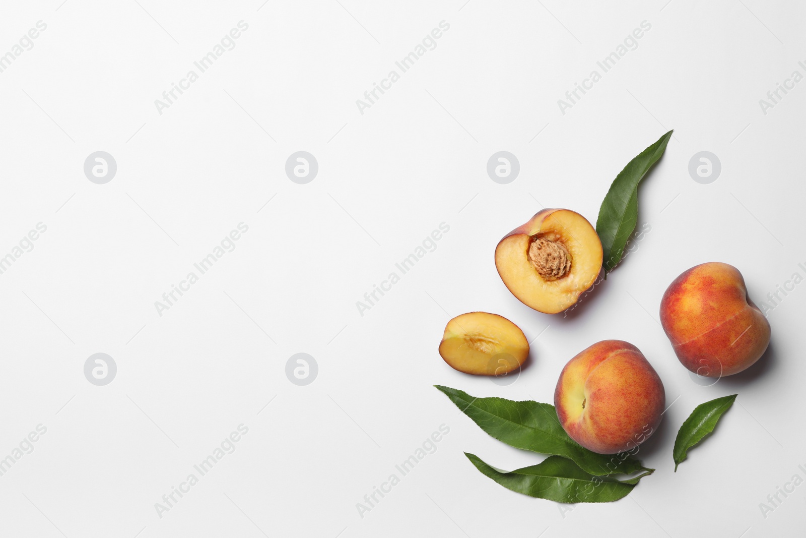 Photo of Composition with sweet juicy peaches on white background, top view