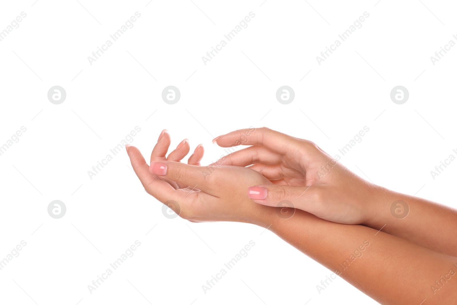 Photo of Woman showing hands with nude manicure on white background, closeup