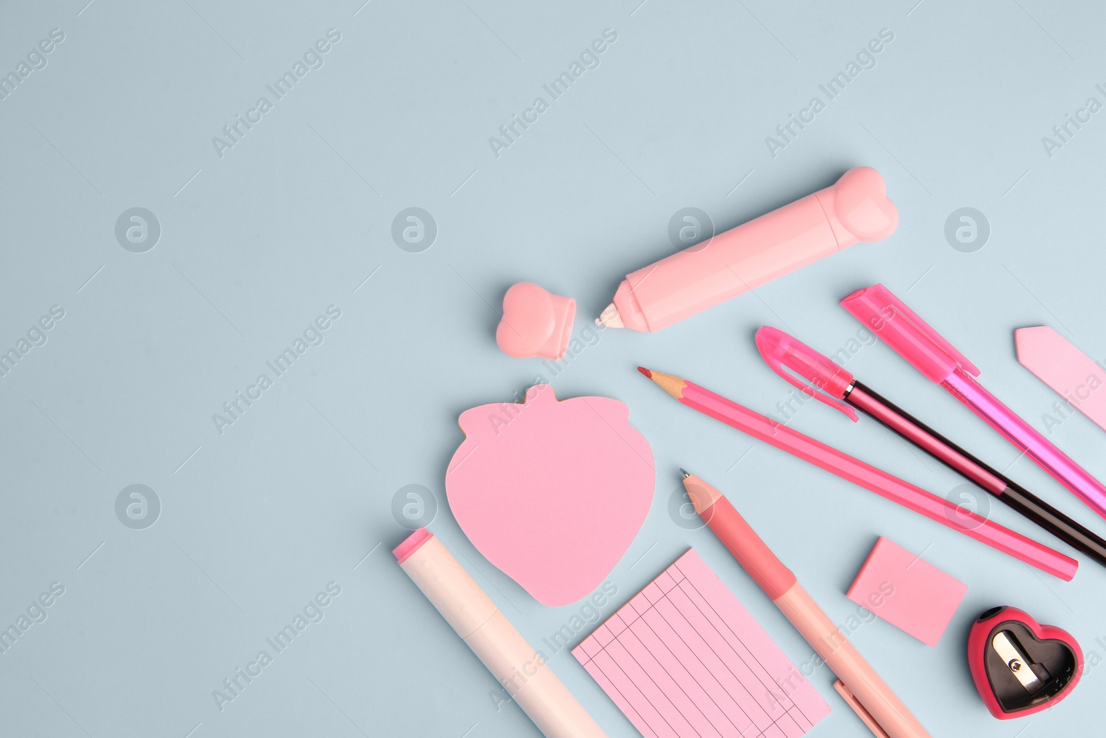 Photo of Flat lay composition with sticky note and other school stationery on light blue background, space for text. Back to school