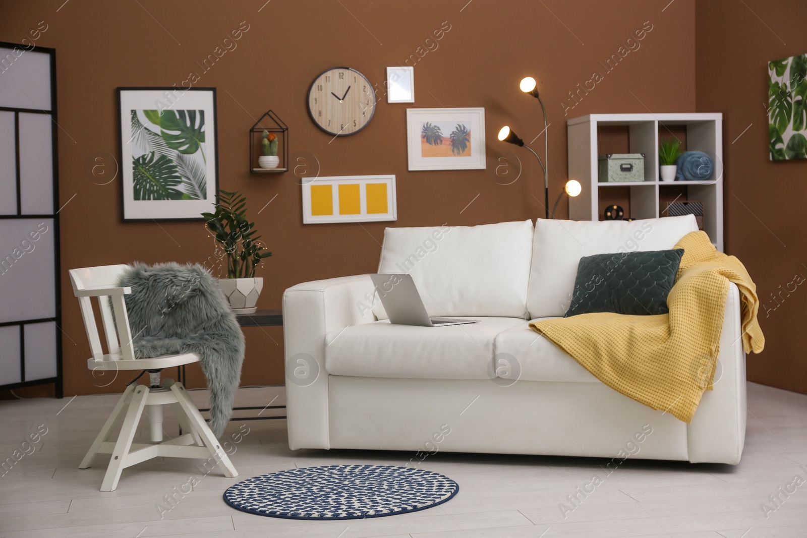 Photo of Stylish living room interior with comfortable sofa