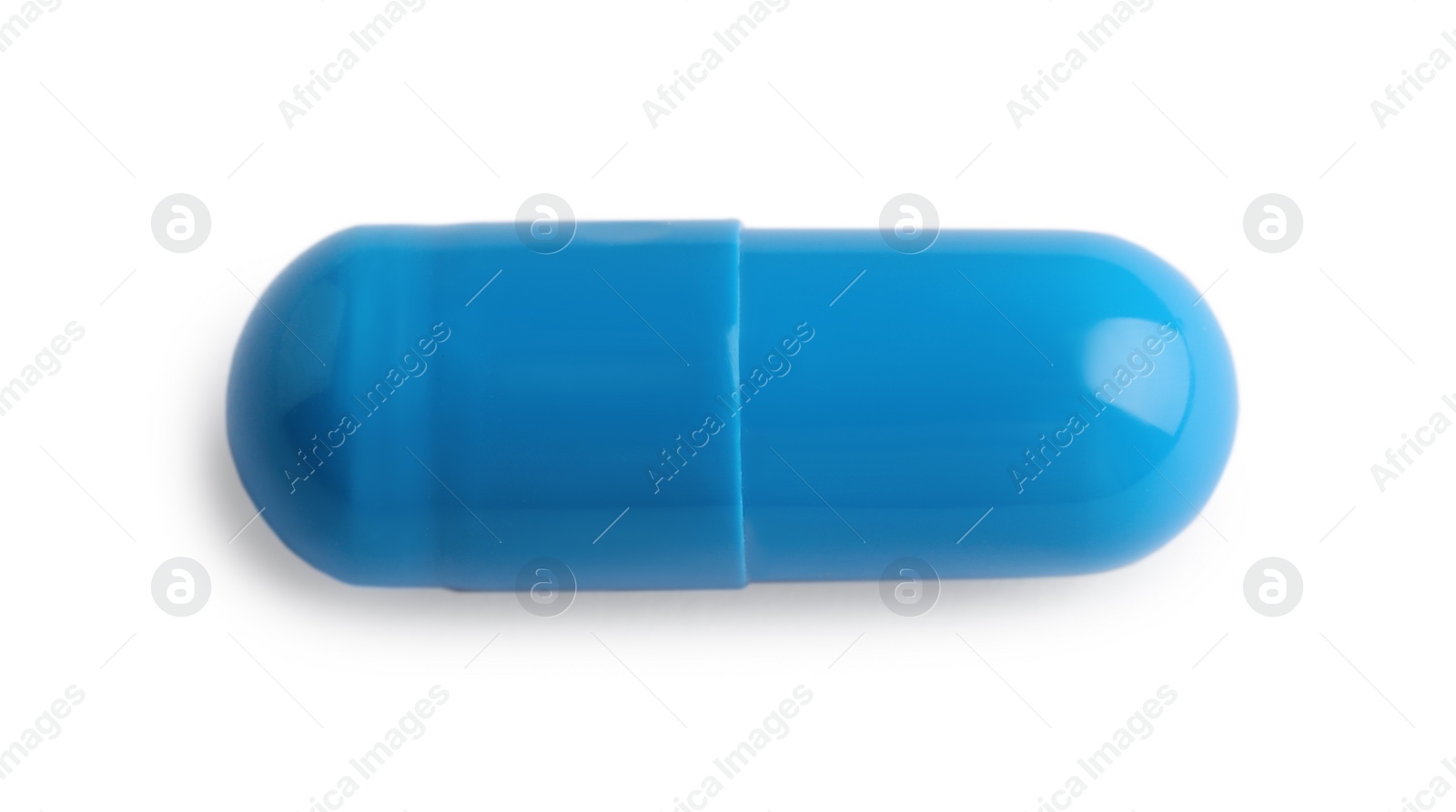 Photo of One pill isolated on white, top view