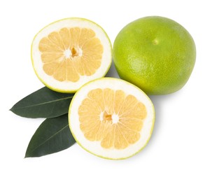 Whole and cut sweetie fruits with green leaves on white background, top view
