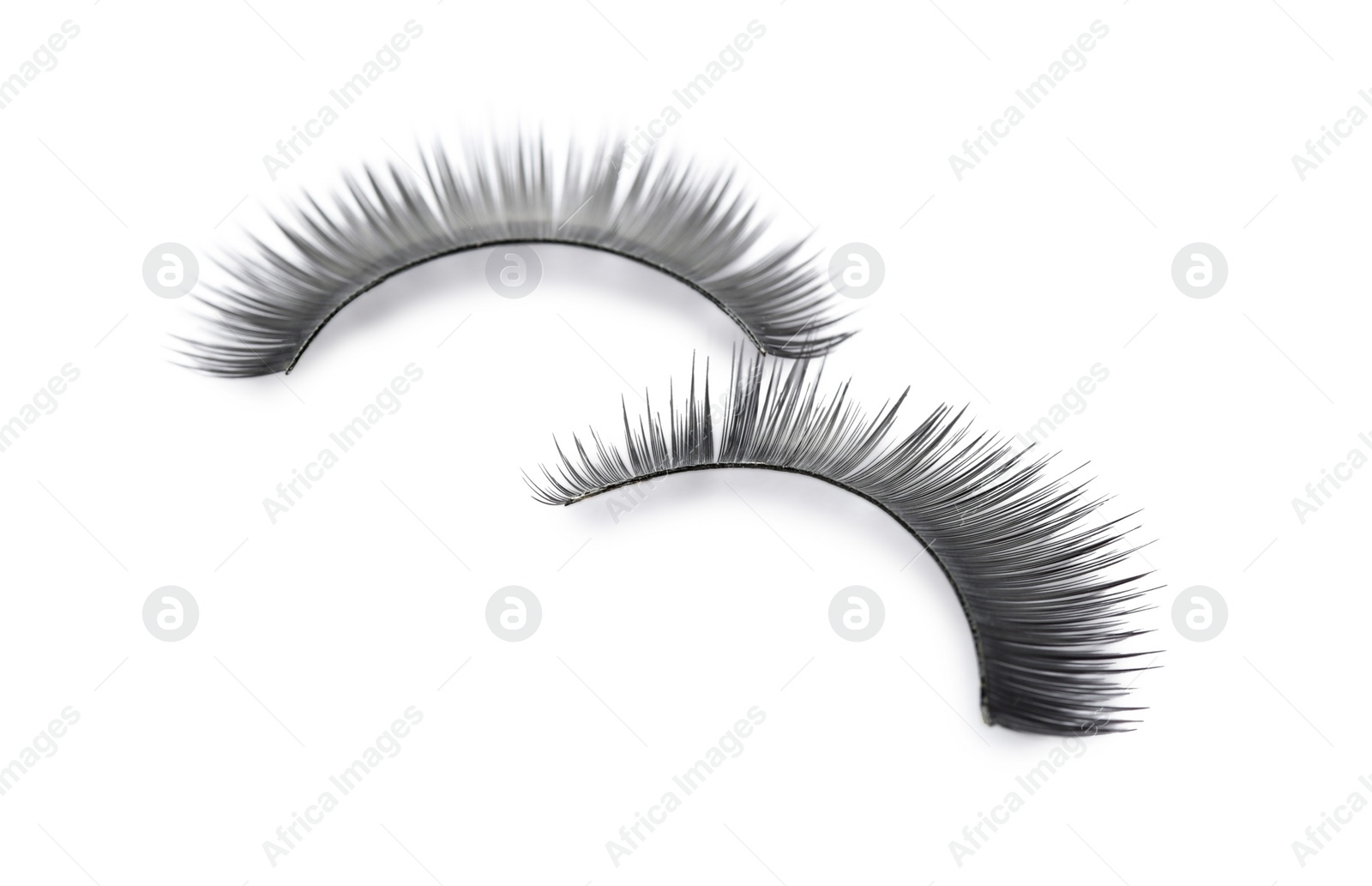 Photo of Fake eyelashes on white background. Makeup product