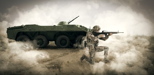 Image of Armed soldier in smoke near armored fighting vehicle outdoors. Banner design