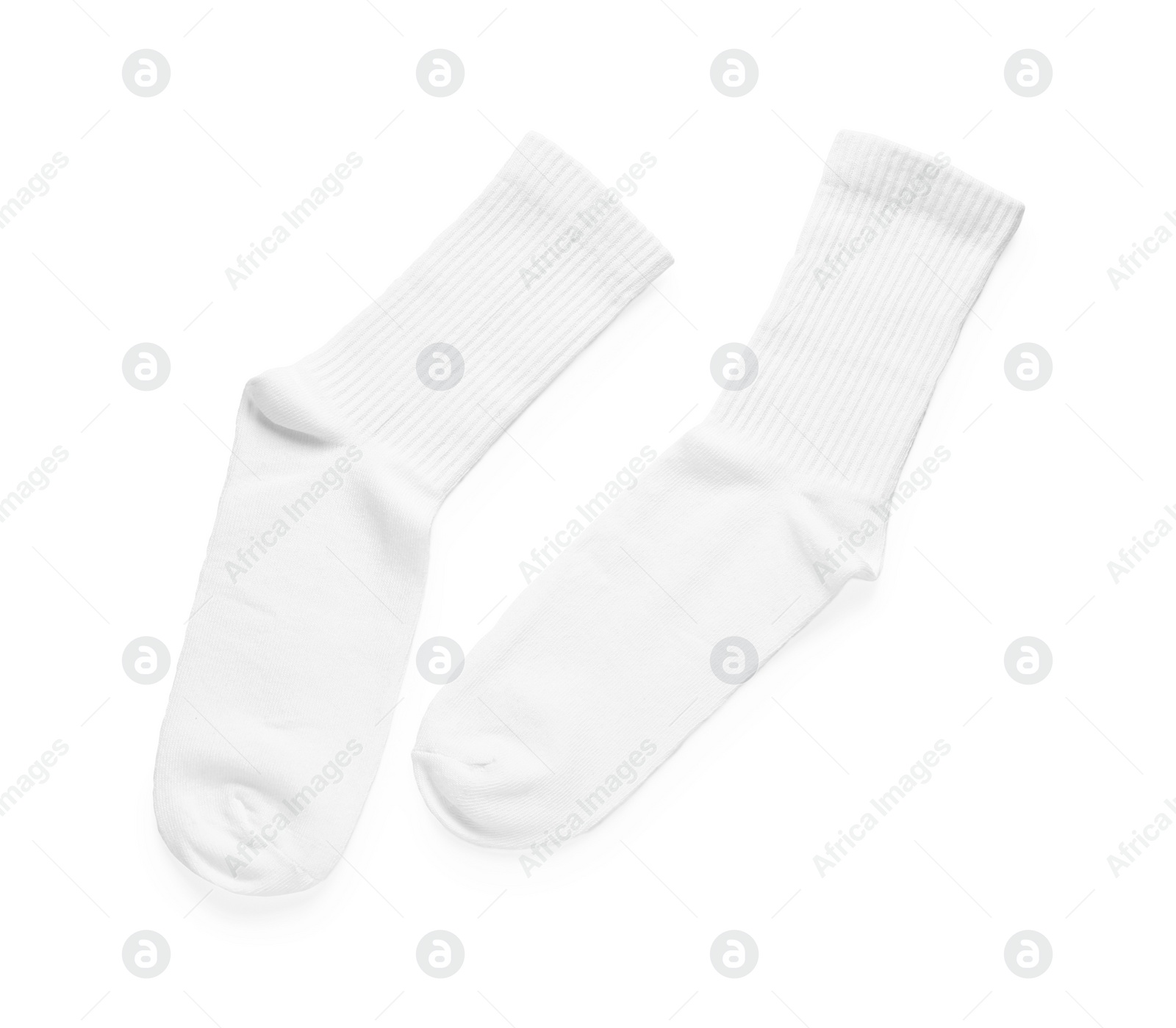 Photo of Pair of stylish clean socks isolated on white, top view
