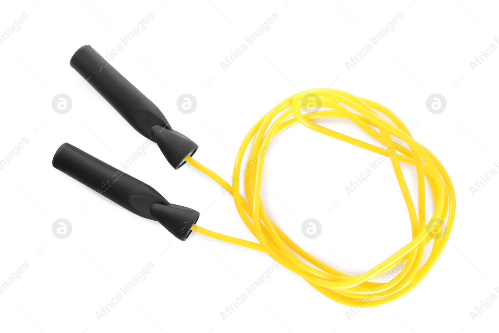 Photo of Yellow skipping rope on white background, top view. Sports equipment