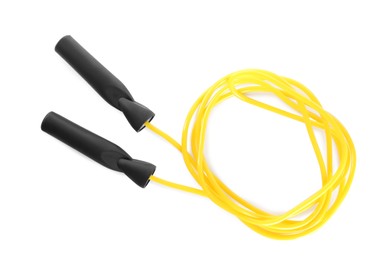 Photo of Yellow skipping rope on white background, top view. Sports equipment