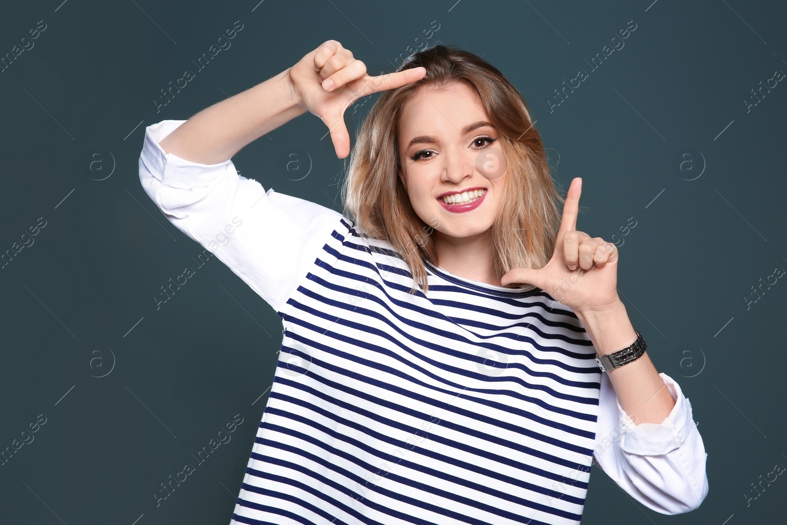 Photo of Beautiful young woman posing on color background