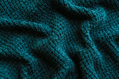 Beautiful dark knitted fabric as background, top view