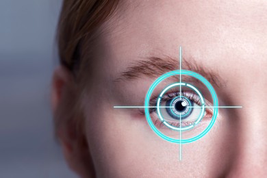 Image of Vision test. Laser reticle focused on woman's eye, closeup