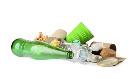 Pile of different garbage on white background. Trash recycling