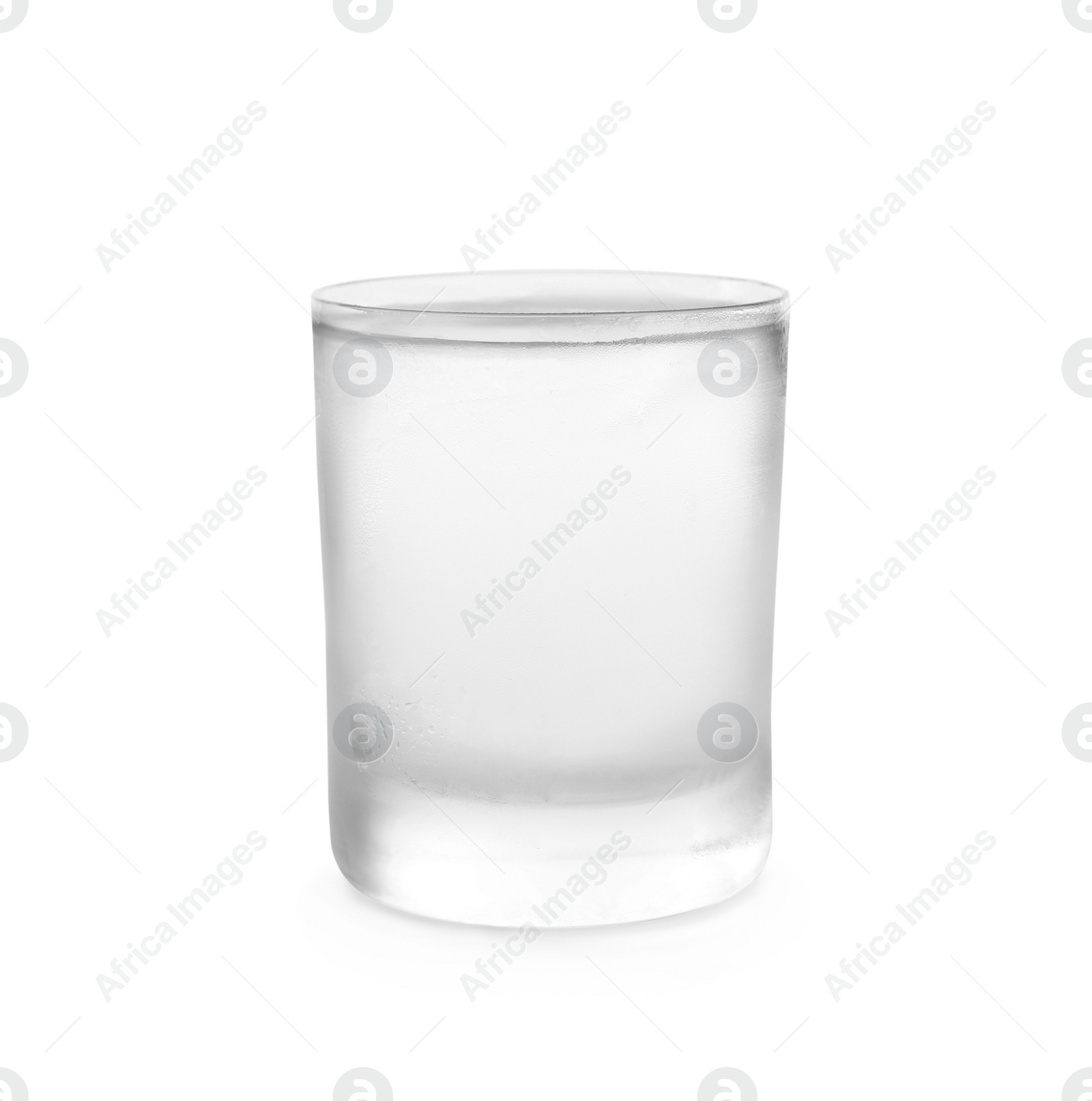 Photo of Shot glass of vodka on white background. Alcoholic drink