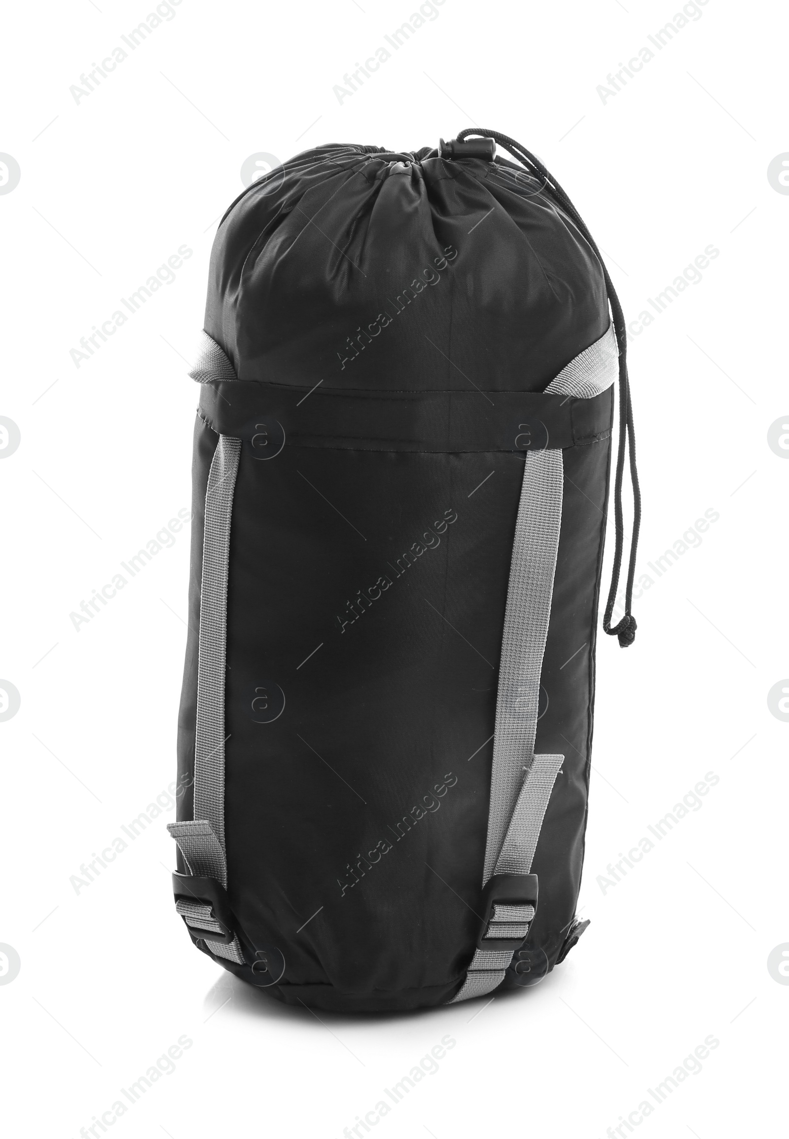 Photo of Sleeping bag in case on white background. Camping equipment