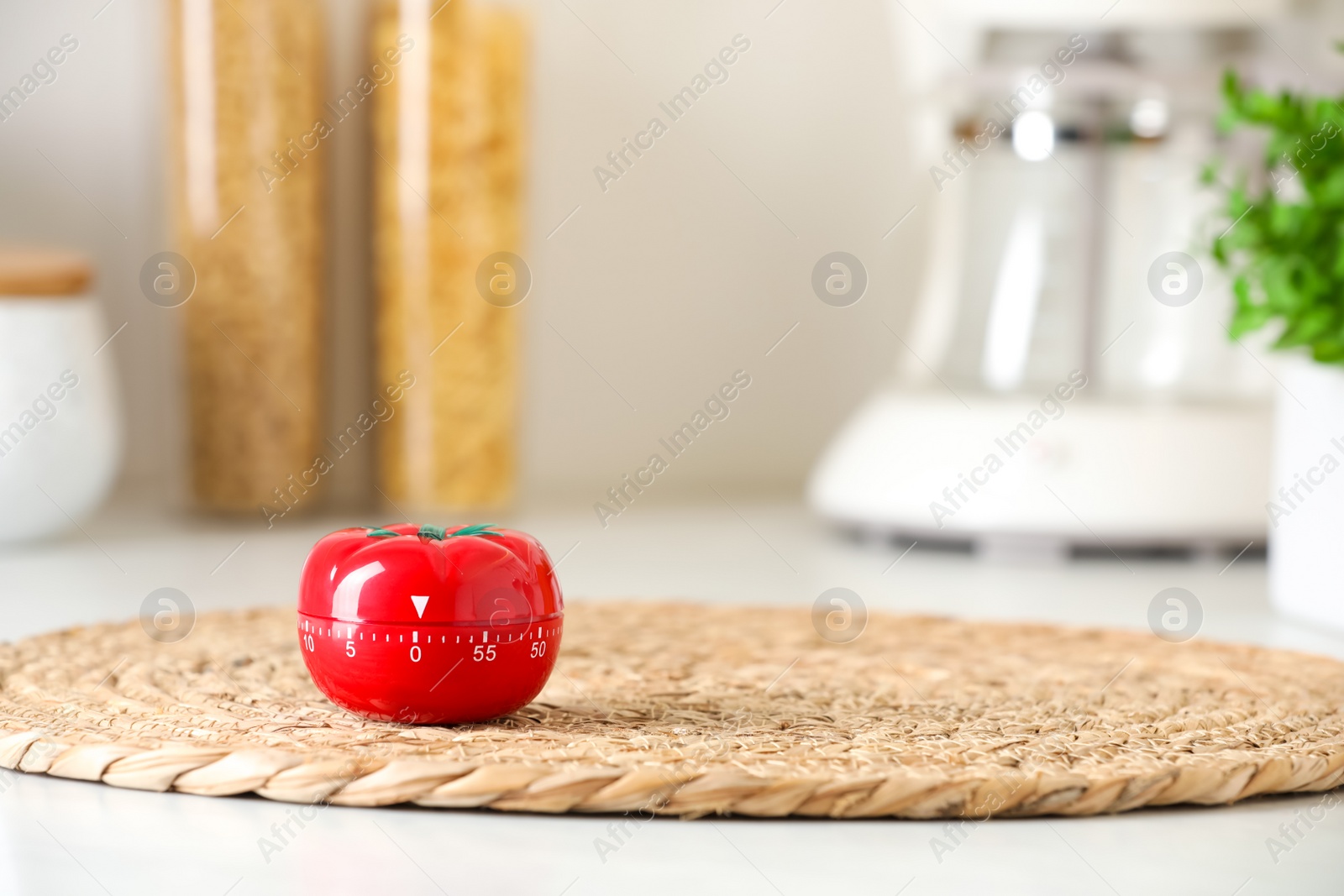 Photo of Kitchen timer in shape of tomato on light table indoors. Space for text