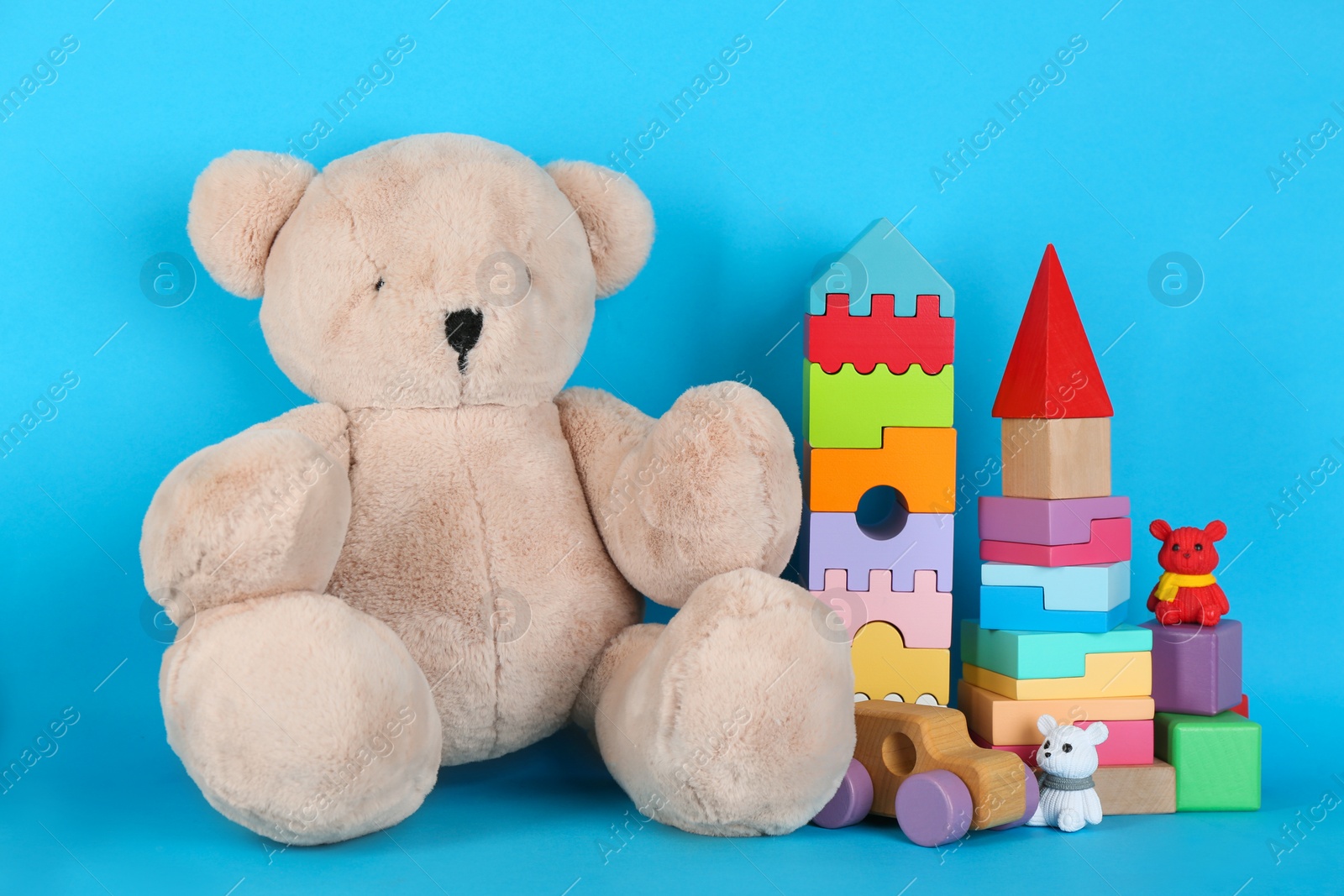 Photo of Set of different toys on blue background