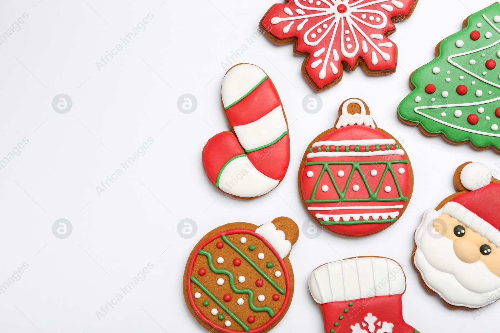 Photo of Different tasty Christmas cookies on white background, flat lay. Space for text