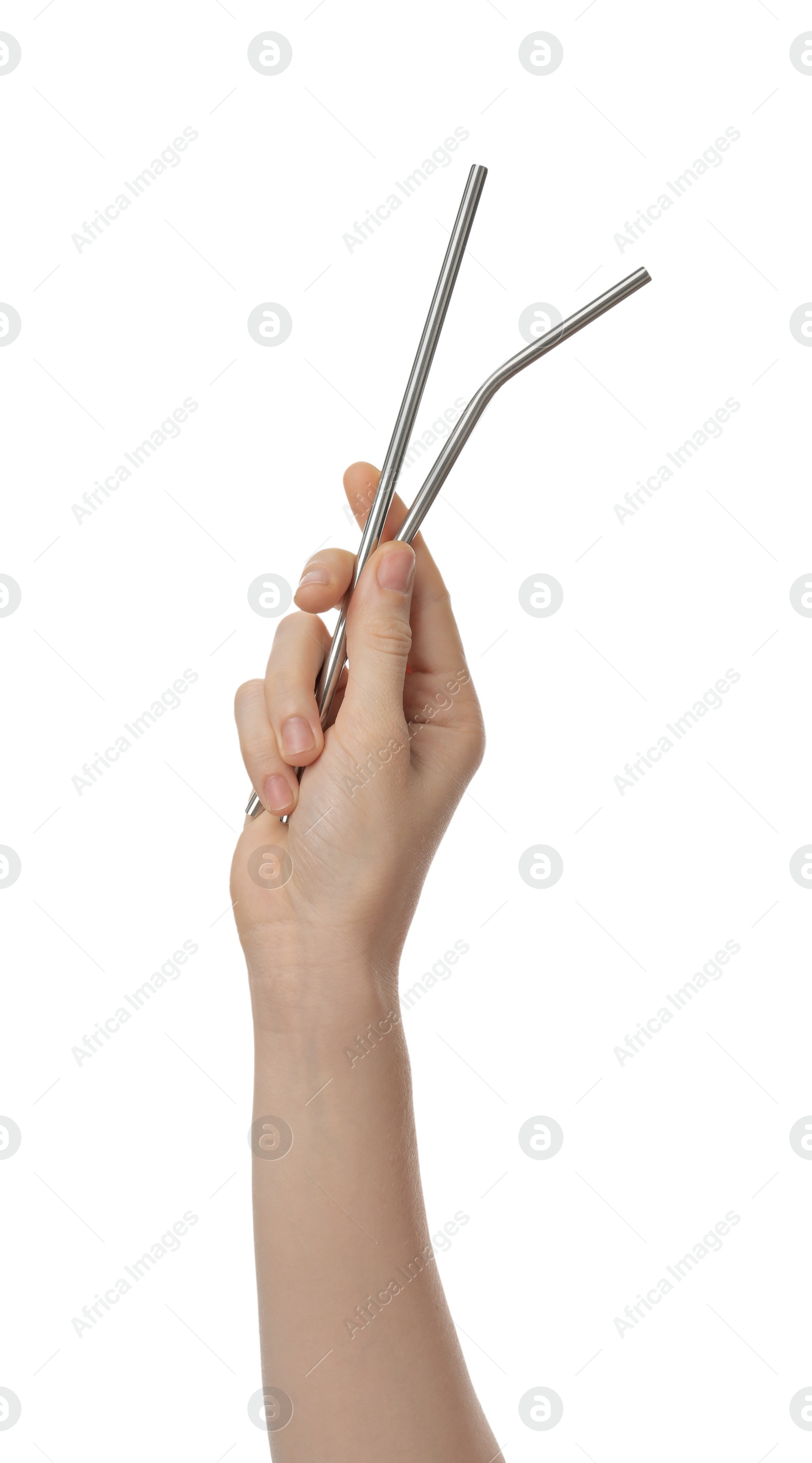 Photo of Woman holding reusable metal straws on white background, closeup. Conscious consumption