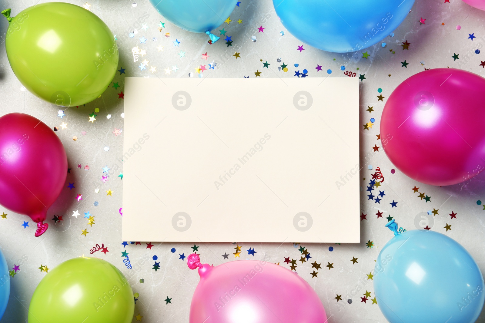 Photo of Flat lay composition of balloons and empty card with space for text on color background