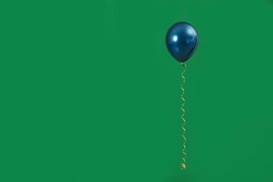 Photo of Bright balloon on color background, space for text. Celebration time