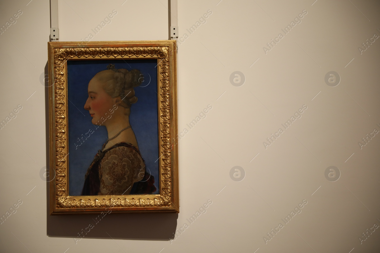 Photo of Florence, Italy - February 8, 2024: Famous painting "Portrait of young woman" by Piero Pollaiuolo at Uffizi gallery, space for text