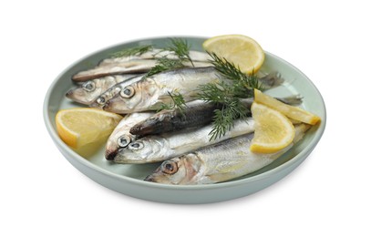 Photo of Fresh raw sprats, lemon and dill isolated on white