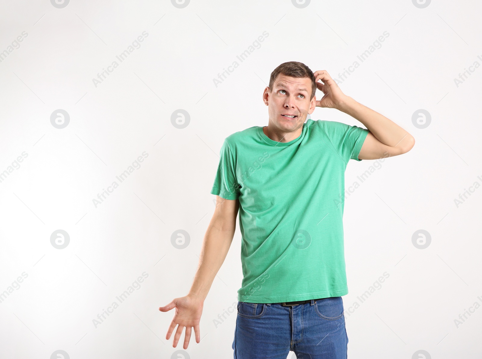 Photo of Emotional man in casual outfit on white background