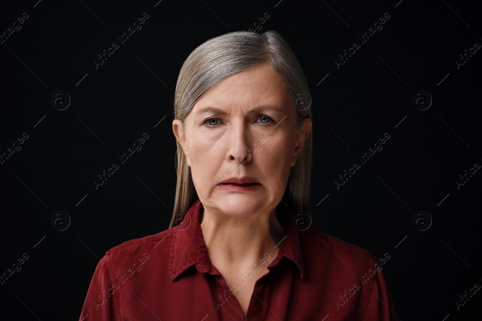 Photo of Personality concept. Portrait of emotional woman on black background