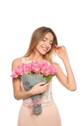 Photo of Portrait of smiling young girl with beautiful tulips on white background. International Women's Day