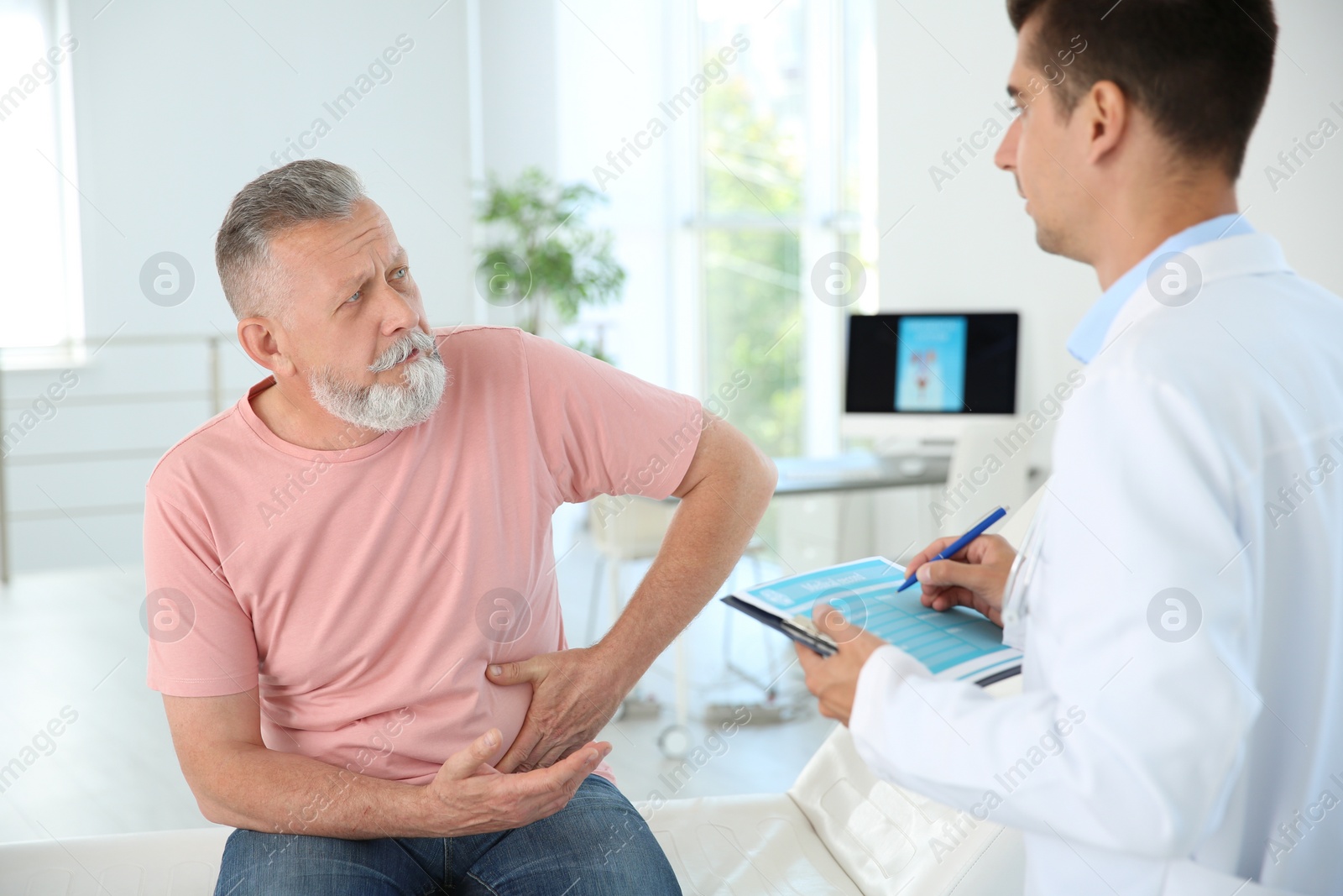 Photo of Man with health problem visiting urologist at hospital