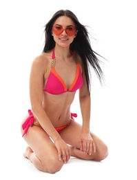 Photo of Beautiful young woman in stylish bikini with sunglasses on white background