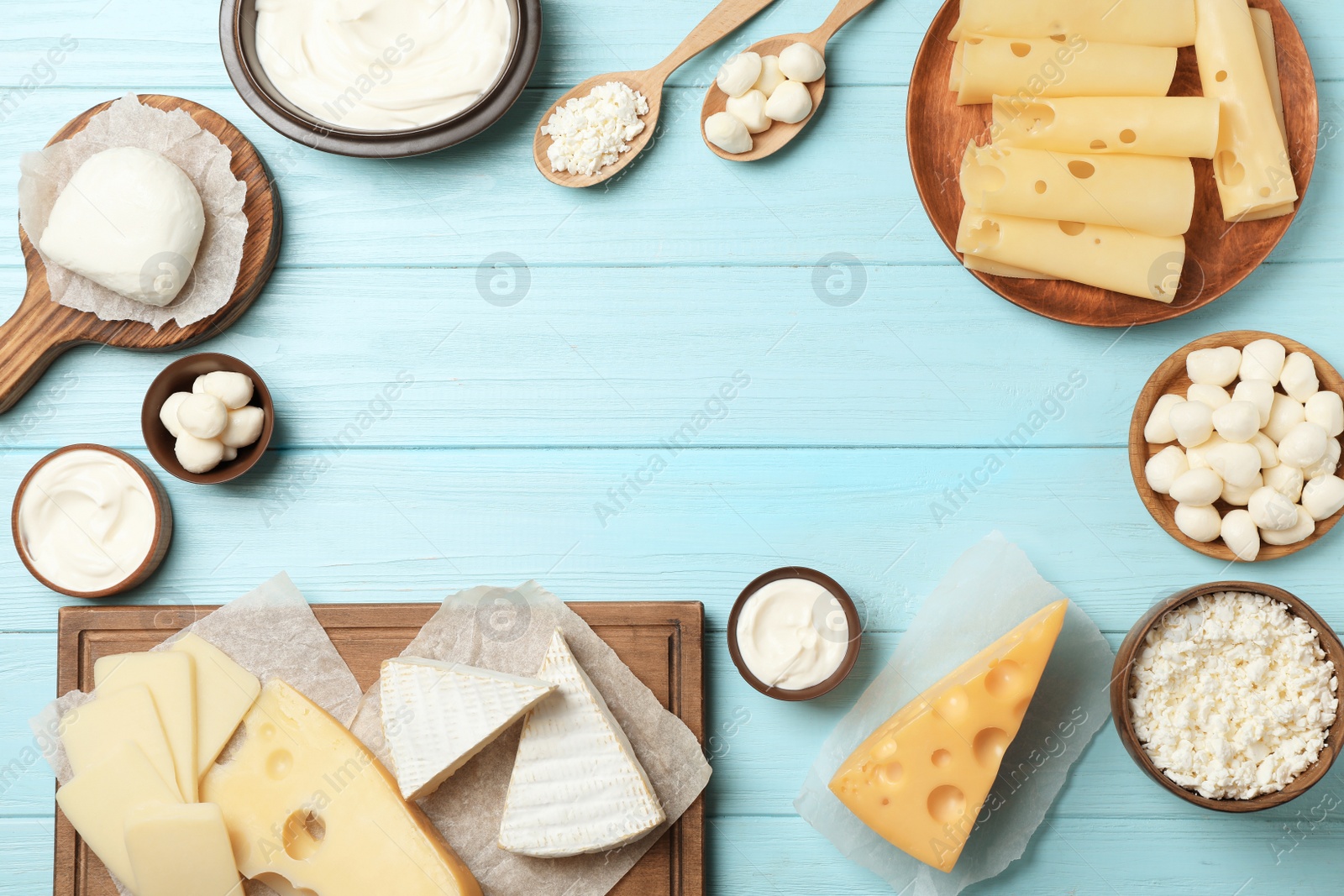 Photo of Flat lay composition with different dairy products on wooden background