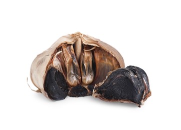 Photo of Bulb and clove of fermented black garlic isolated on white