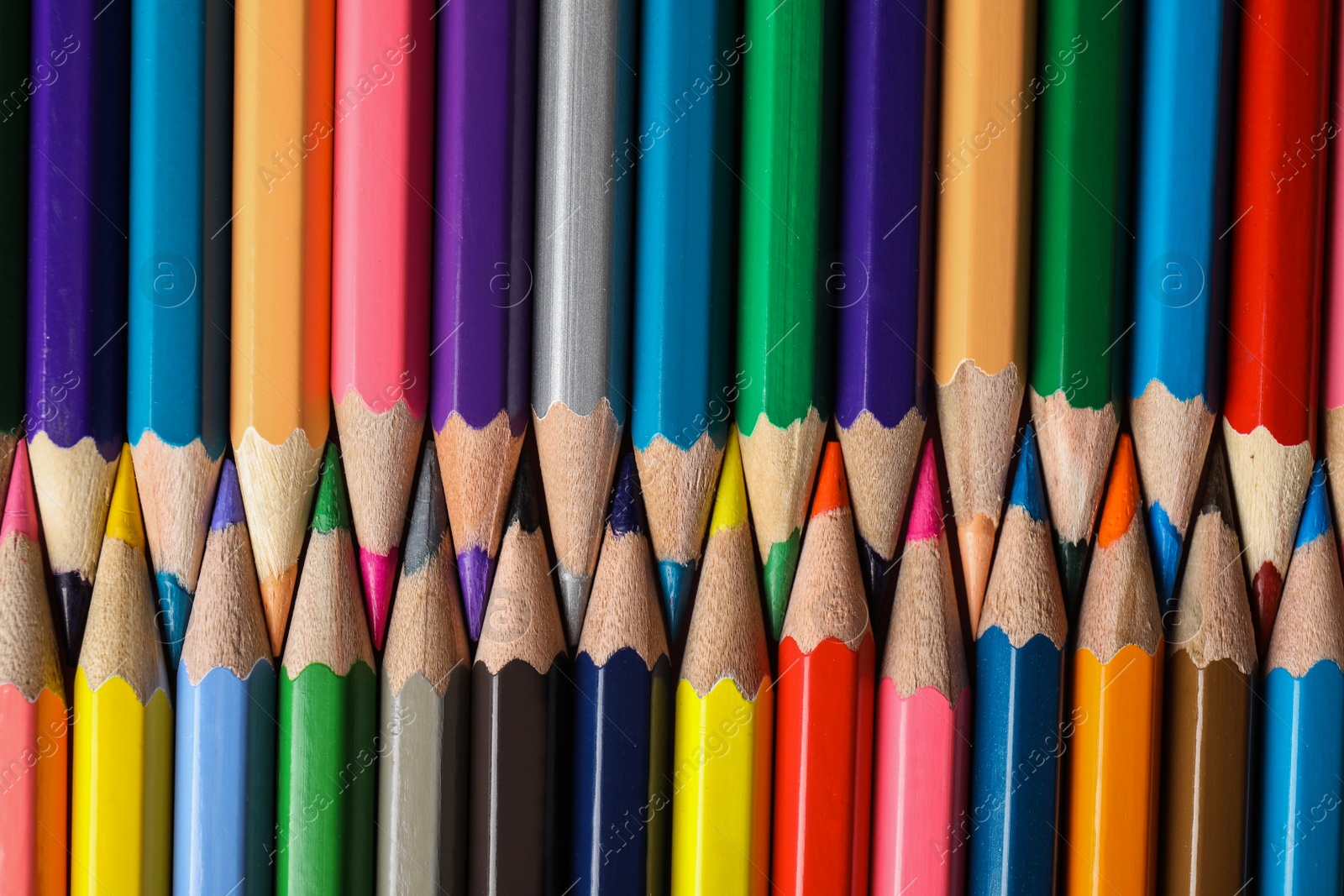 Photo of Different color pencils as background, top view