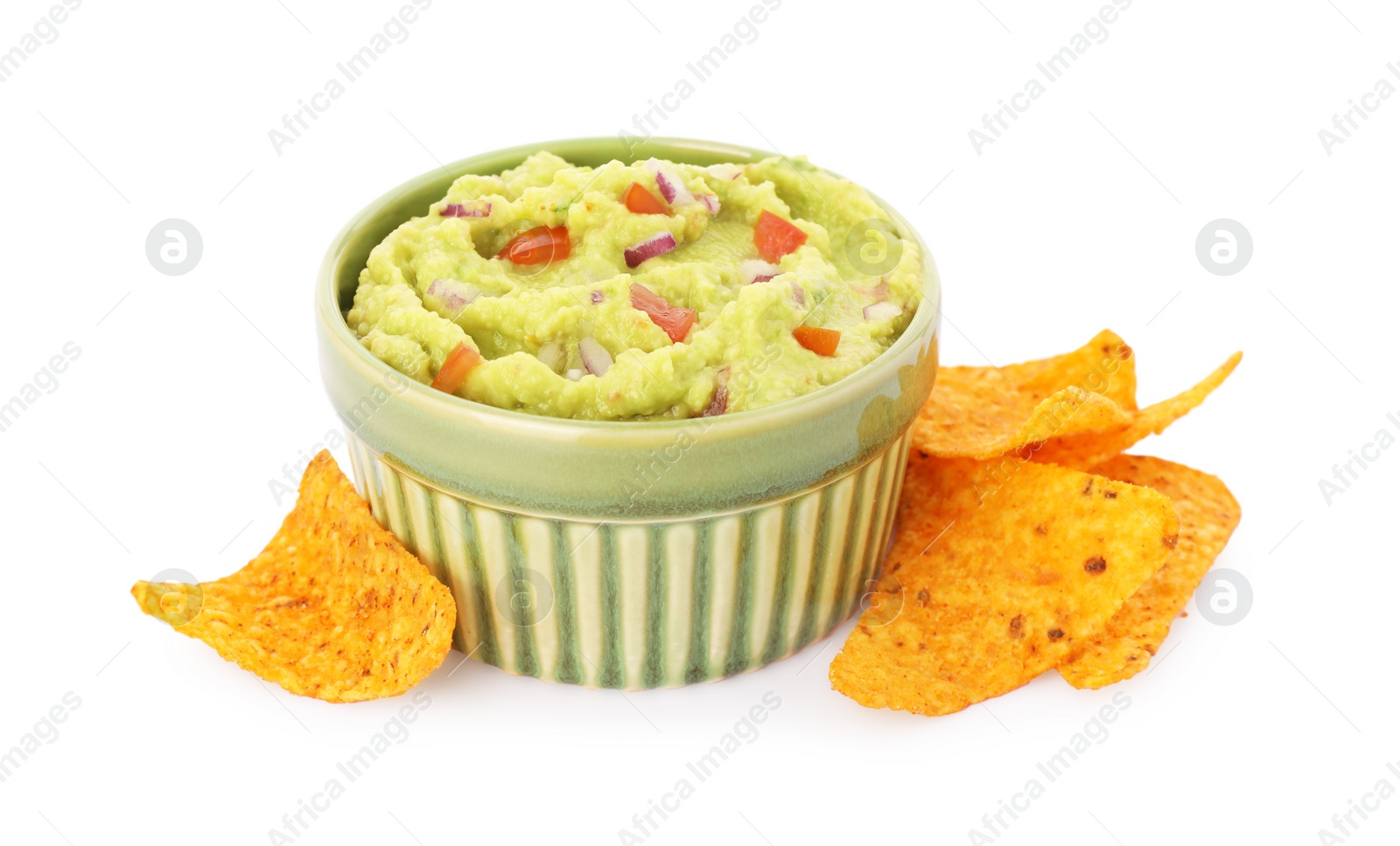 Photo of Bowl of delicious guacamole and nachos chips isolated on white