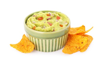 Photo of Bowl of delicious guacamole and nachos chips isolated on white