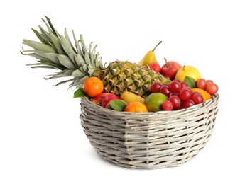 Photo of Wicker basket with different fresh fruits isolated on white